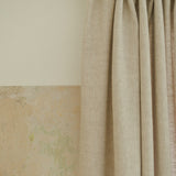 Two tone linen curtain in beige – heading tape gathered on a brass rod