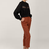 Black lace linen blouse Flore with rust linen trousers, side view