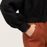 Lace cuff and gathered hem of black lightweight linen blouse Flore